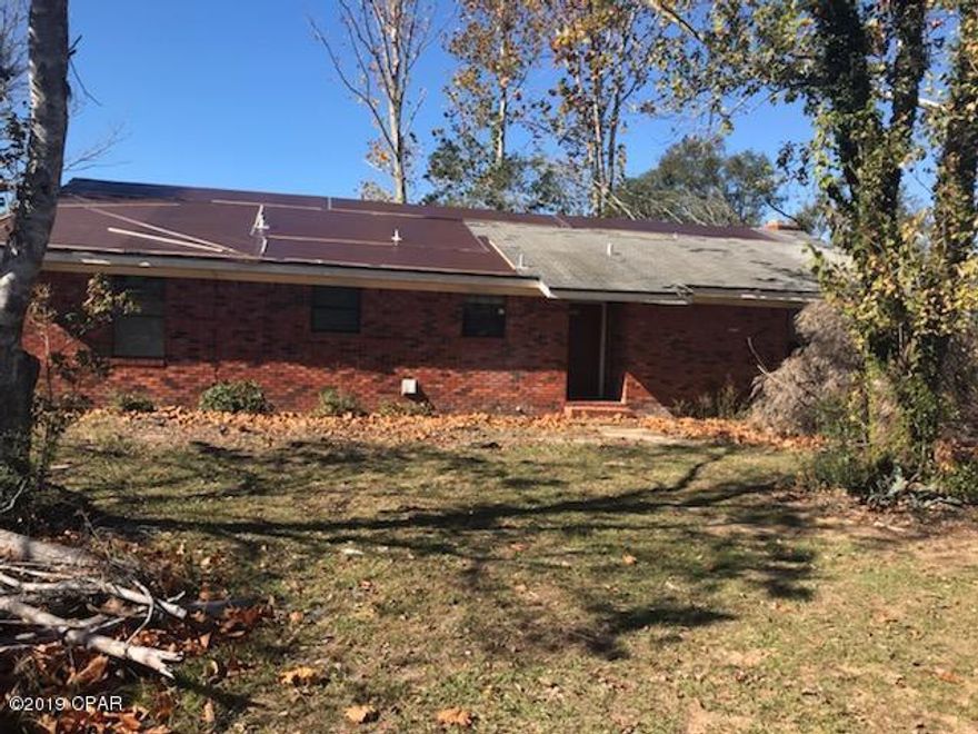 WHAT POSSIBILITES that can be done on this 3 Bedroom 2 Bath Brick Home with over 2000 sq ft under air! Sitting on 10 acres that is high and dry! 32x10 Screen Porch, Large bedrooms. Wood burning fireplace to keep you warm on the cold winter nights! The property has no restrictions, so bring your horses to also call home! Home needs some TLC and will be perfect the home renovation loan. Call today for more information!