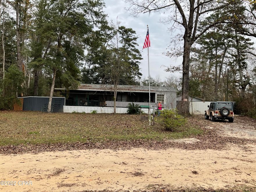 This is a nice double wide mobile home with a great Florida Room and office space. Two bay partially enclosed pole barn with a nice enclosed workshop with 100 amp service and RV hookup.

Located in an older subdivision with Private boat launch and Pavilion for Birthdays, Reunions and Weddings. HOA fees are $100 annually.