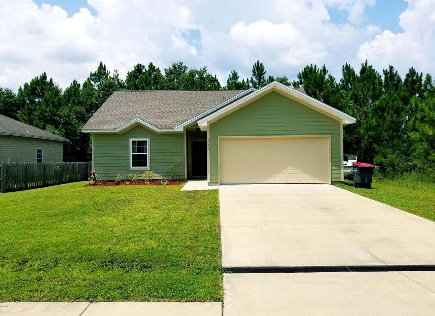 Adorable home waling distance to an elementary and middle school. Open floor plan, tile in wet areas, wood laminate in living and carpet in bedrooms. Cathedral ceilings in living room. The private master has a boxed ceiling with a wonderful master bathroom and HUGE master bath. Home has a split floorplan with additional bedrooms being very spacious. Located on a quiet col-de-sac! Small amount of hurricane damage, will be ready to move into in 8 short weeks!