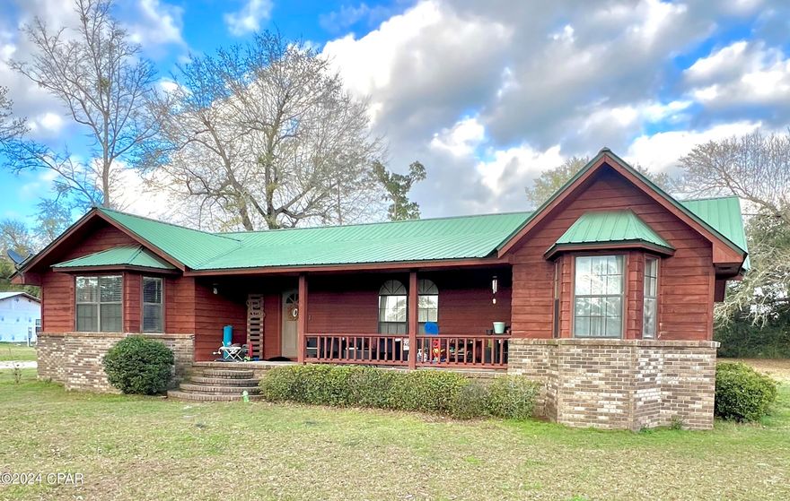 If it's plenty of space your family needs, check out this 1860 square foot 4 bedroom 2 bath ranch in Grand Ridge, Florida.  The home is situated in a quiet neighborhood on a paved road just off of Hwy 90.   In addition to the 4 bedrooms, a 15ft x 15ft room that is currently outfitted as a walk-in closet could be used as a home office or play room, for crafts or homeschooling, or a multitude of other possibilities.  The +\-1 acre property also offers a 30x20ft workshop and plenty of yard space for outdoor activities.  Schedule a tour today and start planning your move!