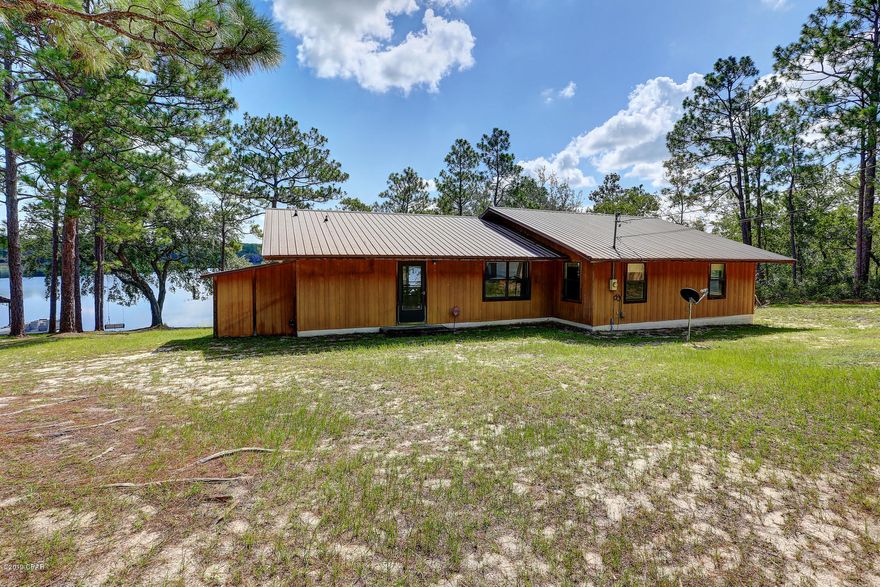 'CURRENTLY UNDER CONTRACT, SELLER ACCEPTING BACKUP OFFERS' must be placed at the beginning of the Public Remarks.* This charming furnished and peaceful 4 bedroom, 3 bath lake house has plenty of room for large family gathering and entertaining. You can sit on the relaxing expansive screened in back porch and take in the beautiful views of the calming lake. The open floor plan offers expansive views from the three sliding glass doors that also lead directly to the screened in porch to expand the space. The kitchen features lots of cabinets and an oversized breakfast bar. The master features a full bath with private entrance to the screened in porch. Other features of this property include a single car garage/work shed, and a Culligan Water Filtration System.  The calm waters of the lake are