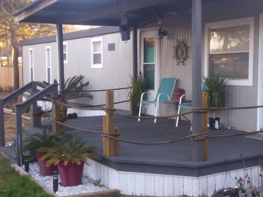 Beautiful updated home on a large corner lot close to the Beach and ready for new owners. Newer Stainless Appliances, New Flooring, Windows, Paint inside and out. Updated baths, larger bedrooms, New HVAC, covered decks front and rear, Some new Privacy fence, storage building, a 14x32 enclosed shop or boat storage with electricity. Fish cleaning station w/water.  Fenced rear yard for pets,  Fruit Trees, and more. Newest shed does not convey.