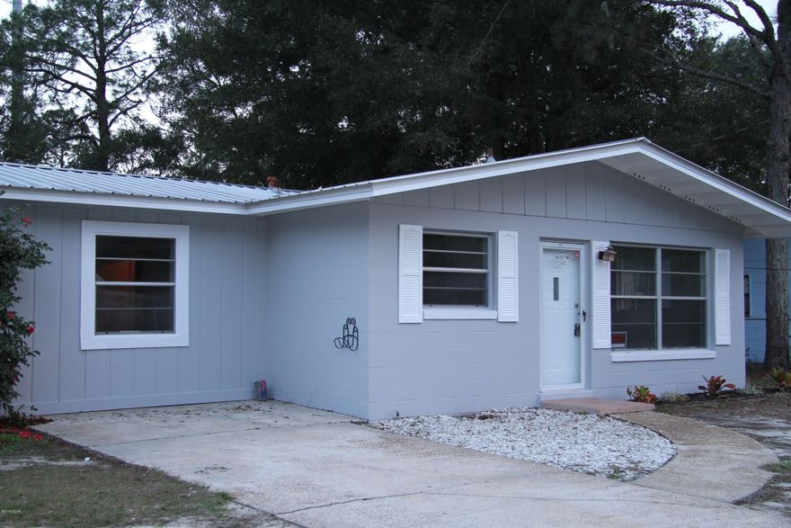 What a cute Florida home! You are gomnna love this place! Freshly painted inside and out this home has  BRAND new floors and BRAND new appliances, with updated counters and new backsplash! Kitchen appliances are on order, will be in soon! This 3 bedroom - 1 bath home is MOVE IN READY. Metal Tab roof, concrete block home, nice fenced back yard in a central location with easy access to the Hathaway Bridge to get to the beaches in 15 min or less.  A detached garage in the back for storage or to use as a workshop.  Lots of charm, neat neighborhood - hurry!  Call your favorite realtor to come and take a look!