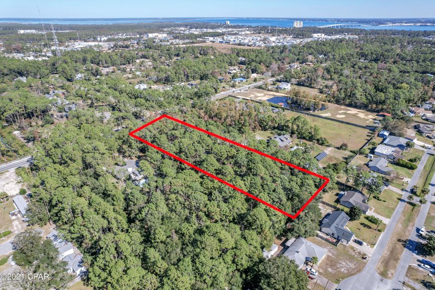'CURRENTLY UNDER CONTRACT, SELLER ACCEPTING BACKUP OFFERS' An incredible gem in Panama City Beach, boasting over 2.3 acres of seclusion. This property, located in the county, is wooded and gives you the ability to sculpt it to your wants and needs. There is a winding dirt drive guiding you through the shaded lot, to where you can start to imagine your stunning dream estate. Enjoy spacious living with the access of being within 5 minutes of having your feet in the sand! To fully understand the natural sanctuary this lot has to offer you have to see it in person.