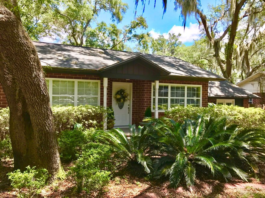 Gorgeous Cove cottage! This one of a kind home has charming details such as beautifully refinished original hardwood flooring, built-in book shelves, a butler's pantry/laundry room, a wood-burning fireplace, a bay window with built-in window seat, a gigantic master suite with his and hers walk-in closets, large kitchen with brick flooring and stainless appliances, new garbage disposal, recessed lighting, energy efficient double paned windows, new insulation in 2012, new AC in 2010 (serviced yearly), and is wired for surround sound in the master bedroom. The exterior of the home is just as charming! Huge oak trees shade both the back and front yard, and there is a large back deck, privacy fence, irrigation on well pump, paved alley, a new vinyl utility shed, and two extra parking spaces.