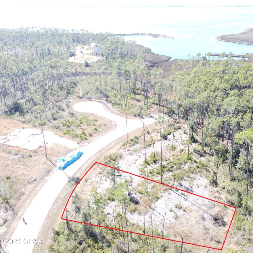 A Beautiful home site in the desirable Laird Point! This lot is located on the west side of the peninsula which is closest to East Bay. Enjoy amazing breezes off the water. Build 2 story and you may discover water views as well. Laird Point is a gated waterfront community boasting ribbon curbed streets and underground city utilities. Amenities include a tennis court and rv/boat storage. Beautiful coastal style homes throughout the community. No pre-set time to build, so you can lock in your spot now, and then build when you are ready. Great proximity to TAFB and Mexico Beach. Full service marina with boat launch just minutes away. Schedule your visit today!