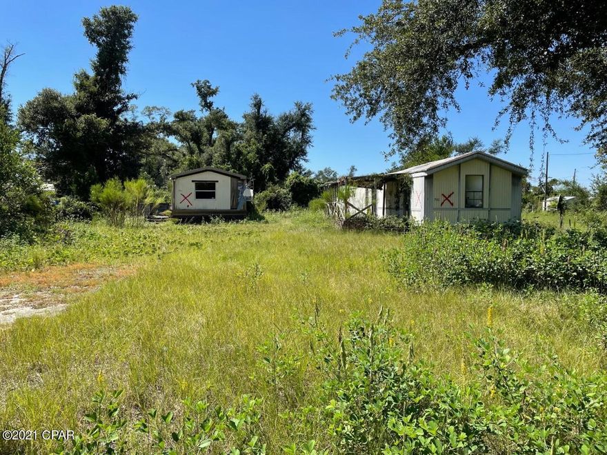 The property has 2 old Mobile homes on it that buyer may remove, no value given to the 2 structures, This property is being sold as is. Presently this property has 2 addresses, buyer will need to verify any details and or any restrictions to replace the present structures. The seller has never occupied this property.