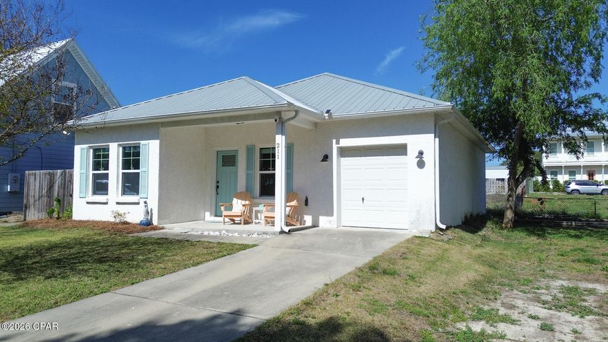 Welcome to 211 El Prado P[ace and your like new Beach House .This floor plan is a  Laguna Beach  classic with 2 bedrooms ,2 full bathrooms and the bonus/ bunk room .Built in 2017  with one car garage that has your electric golf cart that conveys with the purchase of this beach house  . Furnished with very few exclusions .The tile wood look floors are throughout and beautiful . Kitchen has stainless appliances, white cabinets and plenty of counter space for friends and family. Full size stack washer and dryer makes laundry a breeze . On the side is a covered patio for grilling or just relaxing with a good book ,hot and cold shower ,fully fenced . Metal roof 2017 , 2025 HVAC ,new microwave April 2026 .Popular west end of the beach make this home a must see. Whether you want a primary home ,second home or weekly rental home  this is it. Carousel Supermarket ,Thomas Donuts just a few blocks away .Call your realtor today before this home is SOLD .Whether you love 30A or Panama City Beach with Pier Park ,Top Golf or Dolly Pardons Pirates Adventure this central location is everything !