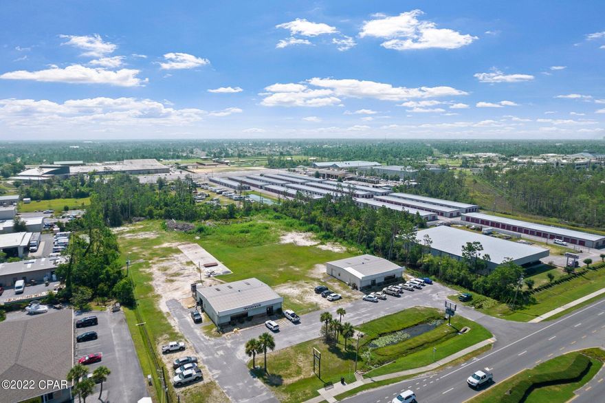 Desirable 2.1 acre property located on busy  Hwy 77 in Panama City.  This is being carved out of an original 4.2 acre property shown in the photos. There is 330' of road frontage on Hwy 77 with ingress and egress in two locations. Annual average daily traffic count is 30,098 vehicles.  The property consists of one metal 60' x 60' retail building complete with finished interior space and covered warehouse storage.  The building being sold is the one of the South side of the property or on the right in the photos. There is parking at the front of the building and an easement will be given to use the driveway to the other building.  There is no direct cut in the median at this location, but the cut is very nearby so turning in from the opposite side of the road is fairly easy.  The back portion of the property is vacant land.  The retail business is not for sale only the building and property.  The business onsite is in a month to month lease.  Please don't disturb the tenants.  The property has a Panama City address, but was annexed by the city of Lynn Haven so utilities and taxes are through City of Lynn Haven.