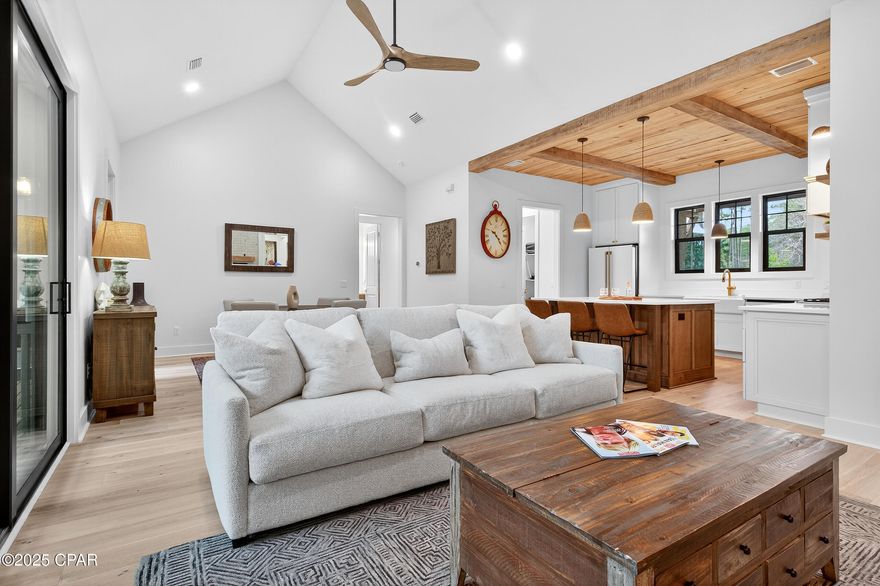 Rare opportunity to own a gorgeous, custom home, built on grade, in the gated, waterfront community of RiverCamps.
Built by CNC Construction in 2024 this home is 2719 sq ft. 4 bedrooms and 3.5 baths and is loaded with upgrades. Cypress wood ceiling in the foyer and kitchen. White Oak wood flooring throughout. White brick gas fireplace for those chilly Florida winter nights. The kitchen overlooks the expansive dining and living area with a cathedral ceiling. Solid wood cabinetry with soft close doors and drawers. GE Cafe appliances including gas top range and convection oven. All appliances including the Samsung washer and dryer convey with the sale. A Butler's/Servery area with a large pantry. Solid core doors throughout. Impact windows. Tiled walk-in showers. Nearly 400 sq ft heated and cooled 4th bedroom or flex area with a full bath above the garage ideal for guests, teens, kids' playroom, an office. So many possibilities.  600 sq ft 2-car garage. Screened in back porch. 
ALL of this located on a quiet .59-acre Lot next to the community trail system that connects to over 7 miles of trails and boardwalks. RiverCamps consists of 1500 acres, less than 450 homesites on 500 acres with the remaining 1000 acres committed to conservation. Situated on West Bay and Crooked Creek, owners can launch their boat from the community boat ramp and,via West Bay, be to Shell Island and the Gulf in as little as 30 minutes. There is day- use boat slips, boat wash stations and dry boat storage. A campsite, with an adult and kid tent and a bath house along the shores of Crooked Creek. Newly completed zero- entry pool. RiverCamps is unlike any other community in Panama City Beach. Far from the traffic and crowds yet only 10 miles from Pier Park and the famous white sandy beaches and 10 minutes from NW Florida Beaches International Airport.
Measurements approximate; buyer to verify all information.