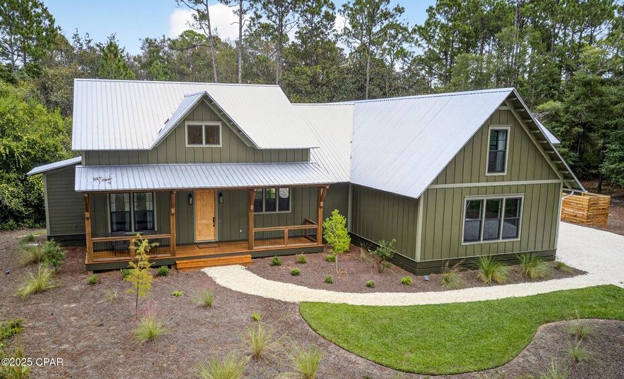 Rare opportunity to own a gorgeous, custom home, built on grade, in the gated, waterfront community of RiverCamps.
Built by CNC Construction in 2024 this home is 2719 sq ft. 4 bedrooms and 3.5 baths and is loaded with upgrades. Cypress wood ceiling in the foyer and kitchen. White Oak wood flooring throughout. White brick gas fireplace for those chilly Florida winter nights. The kitchen overlooks the expansive dining and living area with a cathedral ceiling. Solid wood cabinetry with soft close doors and drawers. GE Cafe appliances including gas top range and convection oven. All appliances including the Samsung washer and dryer convey with the sale. A Butler's/Servery area with a large pantry. Solid core doors throughout. Impact windows. Tiled walk-in showers. Nearly 400 sq ft heated and cooled 4th bedroom or flex area with a full bath above the garage ideal for guests, teens, kids' playroom, an office. So many possibilities.  600 sq ft 2-car garage. Screened in back porch. 
ALL of this located on a quiet .59-acre Lot next to the community trail system that connects to over 7 miles of trails and boardwalks. RiverCamps consists of 1500 acres, less than 450 homesites on 500 acres with the remaining 1000 acres committed to conservation. Situated on West Bay and Crooked Creek, owners can launch their boat from the community boat ramp and,via West Bay, be to Shell Island and the Gulf in as little as 30 minutes. There is day- use boat slips, boat wash stations and dry boat storage. A campsite, with an adult and kid tent and a bath house along the shores of Crooked Creek. Newly completed zero- entry pool. RiverCamps is unlike any other community in Panama City Beach. Far from the traffic and crowds yet only 10 miles from Pier Park and the famous white sandy beaches and 10 minutes from NW Florida Beaches International Airport.
Measurements approximate; buyer to verify all information.