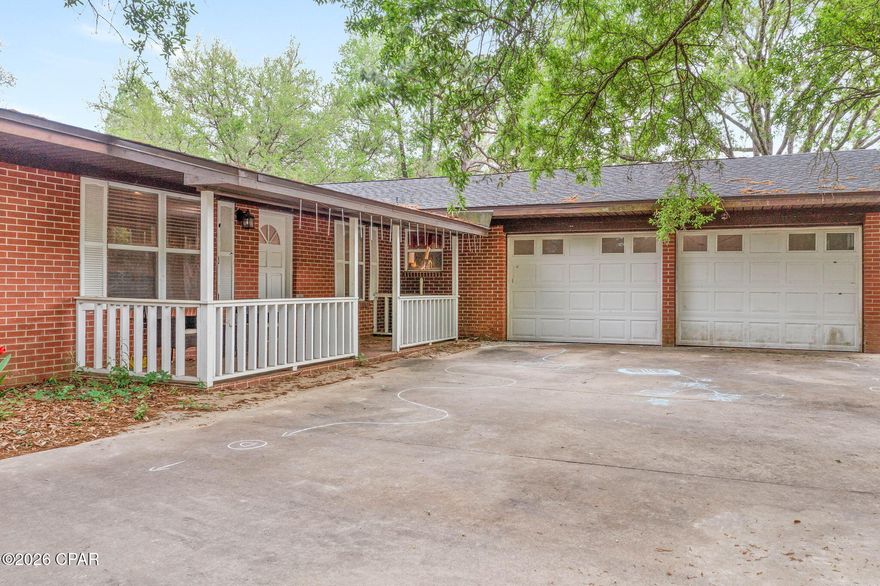 Nestled in the serene landscape of Vernon, FL, 2681 Traverse Drive offers an exquisite blend of comfort and country charm. This expansive 2,724-square-foot home is thoughtfully designed to accommodate both intimate family moments and grand entertaining with ease.

The heart of the home is its large living room, featuring a cozy fireplace flanked by elegant bookshelves--the perfect setting for relaxing evenings. Adjacent to this, a versatile den and a sunlit Florida room provide ample space for gatherings and year-round enjoyment. The chef's kitchen delights with a convenient breakfast bar and separate eating area, making meal preparation and dining social and enjoyable. Accommodations include three generously sized bedrooms and two well-appointed bathrooms, ensuring comfort and privacy for everyone.

Recent updates include a brand-new roof installed in 2024, giving you peace of mind for years to come. Outside, the property shines with thoughtful extras: a sizable detached garage/workshop ideal for projects and hobbies, a charming chicken coop, and a productive garden featuring fig trees, satsuma orange trees, and grapevines--perfect for those who love self-sufficiency and fresh harvests.

Best of all, this home sits on beautiful grounds with direct water frontage on what is believed to be a spring-fed pond, offering peaceful water views and a tranquil connection to nature. It is also in close proximity to Holmes Creek, making it ideal for fishing, kayaking, or exploring the local waterways. Located less than an hour from the white-sand beaches and vibrant attractions of Panama City Beach, you'll enjoy the perfect balance of peaceful country living with convenient access to coastal fun.
Don't miss this exceptional opportunity to own a slice of paradise in Vernon!

Note: Some photos were enhanced with AI software to brighten up the room or remove items to give a more complete view of the rooms.