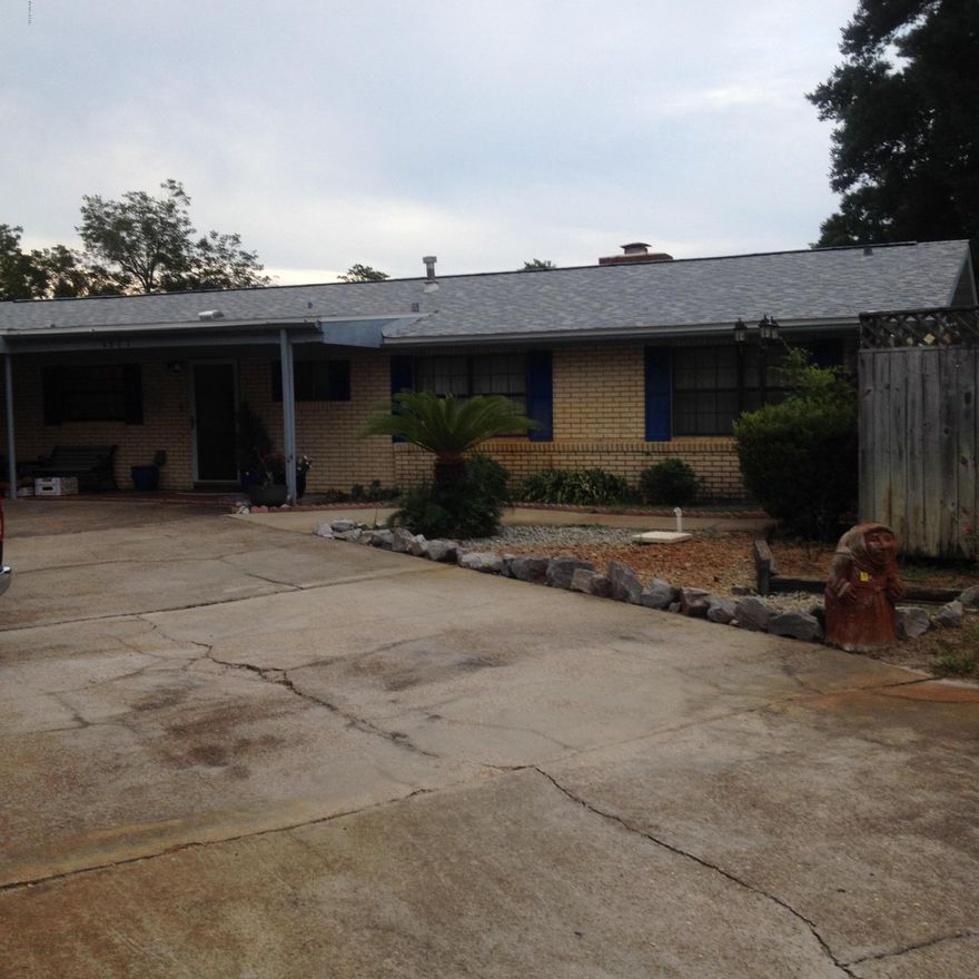 Very large pool home in an established neighborhood, privacy fenced, fruit trees, and a lot of ammenities. It needs some cosmetic work, but with this great location close to Tyndall Air Force Base, shopping, and downtown business district this house is a bargain.  Gas stove, energy efficient heat pump, and all brick make it very easy to keep. There's a giant family room waiting for your home theater set up. There's a den with a fireplace, covered patio, and a Florida room. Over sized detached garage has parking for one car and a lot of extra room.