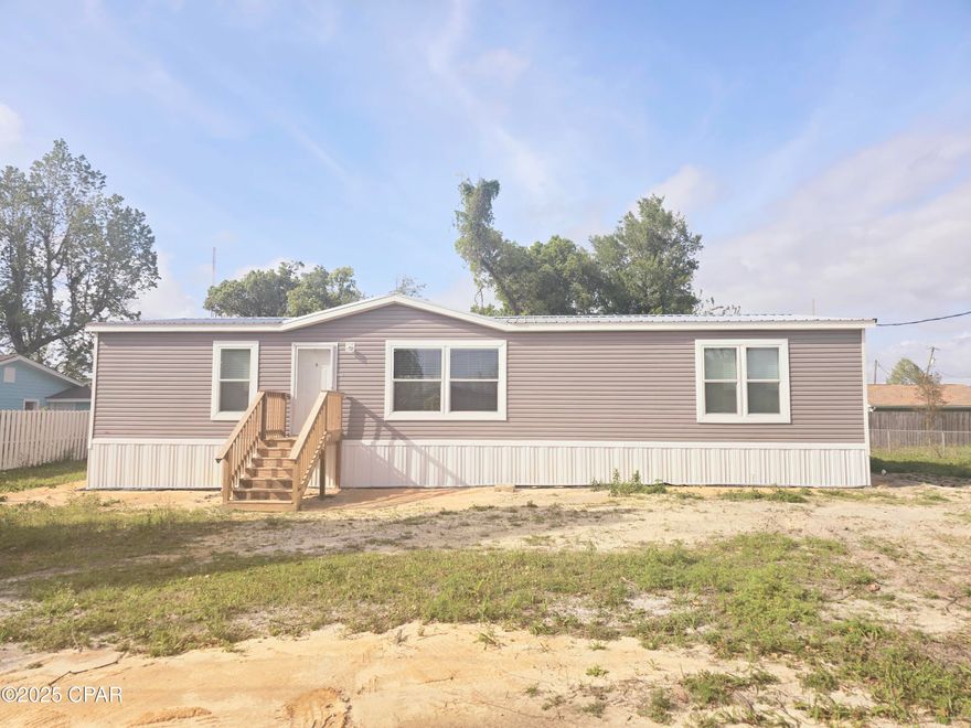 Welcome to your new home in beautiful Panama City! This 3 bedroom, 2 bathroom manufactured home offers comfort, style, and all the modern conveniences you're looking for.

Step inside to find luxury vinyl plank (LVP) flooring throughout, giving the home a sleek, durable finish. The open-concept kitchen is equipped with stainless steel appliances, perfect for cooking and entertaining.

Cozy up by the electric fireplace in the living room — a stylish and efficient centerpiece for relaxing evenings. With spacious bedrooms, ample storage, and a modern layout, this home is designed with your lifestyle in mind.

Don't miss your chance to live in this beautifully upgraded gem — schedule your tour today!