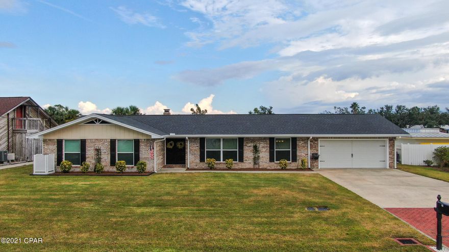 Waterfront!  This beautiful 4 bedroom, 2 bath home in Lynn Haven sits right on the water with plenty of room to add your own dock.  The kitchen and living room are open concept, with magnificent water views.  The two car garage also has a workshop for your honey do projects.  Talk about outdoor living... the covered patio is an amazing place to spend your afternoons watching dolphins play on the water.  There is also a large storage shed in the backyard you can easily make into a she shed.  The yard is perfectly manicured and the gutter downspouts empty into the bay.  The driveway has beautiful pavers leading you home.  Call today for your private tour.