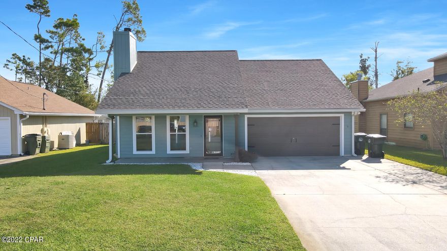 MOTIVATED SELLER! Beautiful home in Lynn Haven. Renovated 4 bedrooms, 2.5 bathrooms. New roof, new doors, new windows, new carpet and LVP flooring in living and kitchen. Freshly painted! Stone fireplace. The kitchen features granite countertops, hardwood cabinets, and stainless appliances. The downstairs master bedroom is large and features an ensuite bathroom with tiled shower/tub, a double vanity, and large walk-in closet. 2nd bedroom is also downstairs. The upstairs features 2 additional bedrooms, or 1 bedroom and a bonus room. They upstairs bedrooms share Jack and Jill bathroom. The home is wired for a pool/hot tub, and features a privacy fence. Protected land behind the home ensures privacy. Home is offered with a 1-year home warranty.