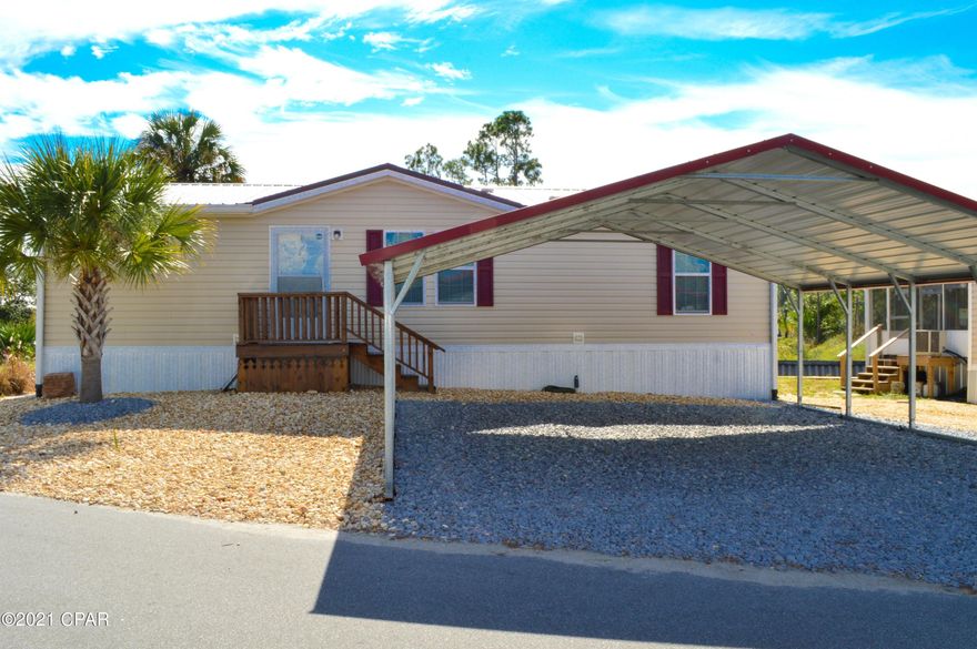 Looking for a vacation rental/investment property without the HOA fees?  This waterfront home is ideal & short term rentals allowed!  This is a 3BR/2BA manufactured home with a covered boat slip with a 4500lb lift on a canal with bay & gulf access!  There is also a pool & deck making this an ideal spot for a weekend retreat or make this a full-time residence!  The home features a split-bedroom floor plan, luxury plank vinyl flooring throughout, 3 year old metal roof, R-30 insulation in the attic & extra added to the walls and floors, a screened porch, & a RING alarm & security system.  There is also a two car carport & NO grass to cut.  Bayside Marina & boat launch is a few blocks away.  All info approx & must be veri