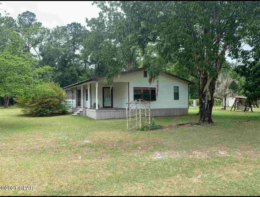 For comp purposes only. Spacious 4 bedroom 2 bathroom mobile home on an oversized fenced in 6.2 acre lot surrounded by the national forest! The lot has tons of mature magnolias and live oak trees. The property has multiple grape vines, multiple fruit trees, and a creek running on the back portion of the property. This property has horse potential! The home has a huge living and dining combination main room. The front porch is gorgeous with hooks already screwed in for a nice porch swing. Part of the front porch is screened in as well. The back door has wheelchair access with a ramp. There is tons of storage in the sheds on the property. The property also includes a carport with room for multiple cars. The metal roof was put on in 2019! This is a must see property!
