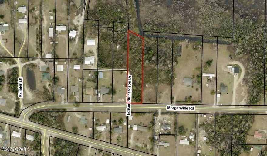 One acre vacant lot backing  up to canal with access to Bear Creek, offered as is.  The lot is on a paved road.  Lot size is approximated and taken from county records.