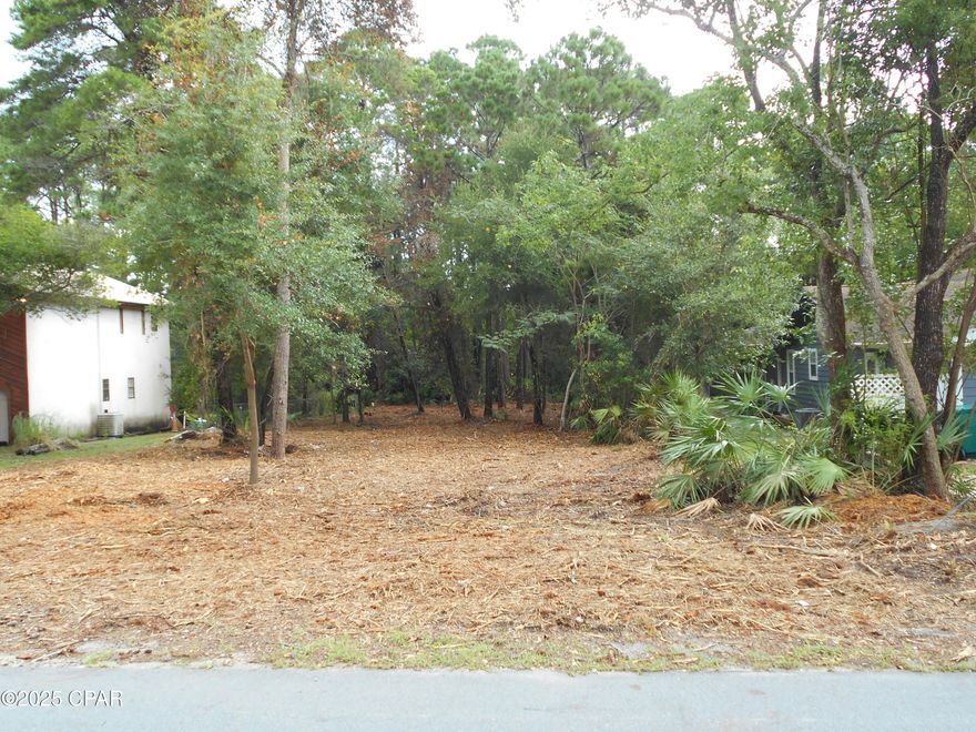 Recently bushhogged, this lot has been cleared of all the excess foliage and is ready for your new home design.  Located just 1/2 mile to the new hospital on Hwy 79, and just 1 mile to Pier Park, this lot is larger than most.  At 70' wide and 200' deep, you will have room for your new home, pool, RV, and storage shed.  Just imagine the possibilities.  Call your builder today.  All meas. are approx.