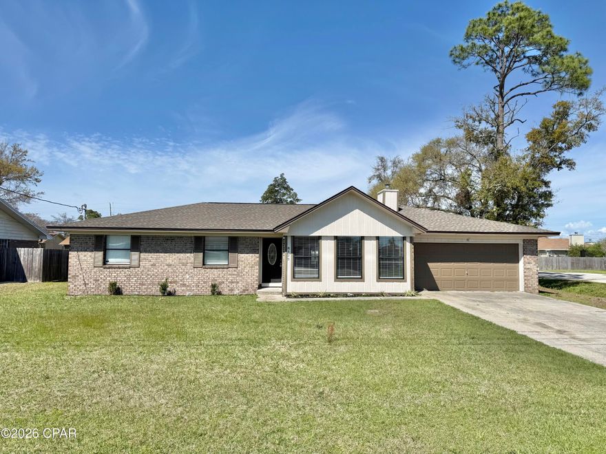 Charming all-brick 3 bedroom, 2 bath home situated on a large corner lot in the heart of Callaway. This 1,744 square foot home offers a spacious living and dining room combination with vaulted ceilings and a beautiful brick wood-burning fireplace, creating a warm and inviting atmosphere. The kitchen area includes a cozy breakfast nook, perfect for casual dining. Step outside to enjoy the screened-in rear patio overlooking the backyard.

The oversized corner lot provides convenient rear yard access, making it ideal for boat or RV storage. Additional features include a two-car garage, fresh interior paint throughout, and brand new carpet in all three bedrooms.

Seller is offering a $1,500 appliance credit at closing with acceptable offer. A few minor finishing touches are still being completed. Conveniently located just minutes from Tyndall Air Force Base and approximately 30 minutes from the beaches of Panama City Beach.