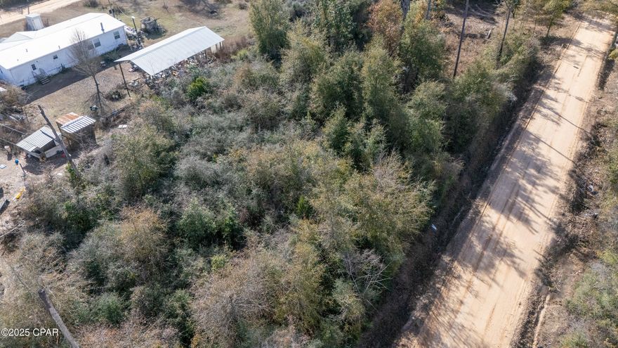 Discover a prime lot in Fountain, Florida, located in the peaceful Green Hills Subdivision. This wooded, ready-to-build property offers the perfect setting for your dream home or mobile home.