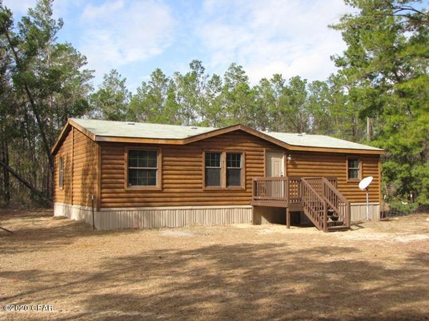 A GREAT BUY on a 3 Bdr 2 Bth Manufactured Home that has been completely renovated and is like new condition. Attractive Log Siding and on a 1+ Acre lot located in Southern Washington County less than 1 mile North of Crystal Lake. Nice Quiet location and less than 30 minutes into Panama City. All New Floor Covering and Fresh Paint throughout. New Window Treatments on most windows. Comfortable Living / Family Room, nice Master Bdr, Master Bth with Dbl Vanities plus separate Tub and Shower, Big Kitchen with Built-In Desk, Work Island, Range, Refrigerator, etc, BRAND NEW HVAC . This Home is MOVE-IN READY !! Possible Seller Financing based upon review of Buyer's Credit Application. ACT NOW to take advantage of this GREAT OPPORTUNITY !!