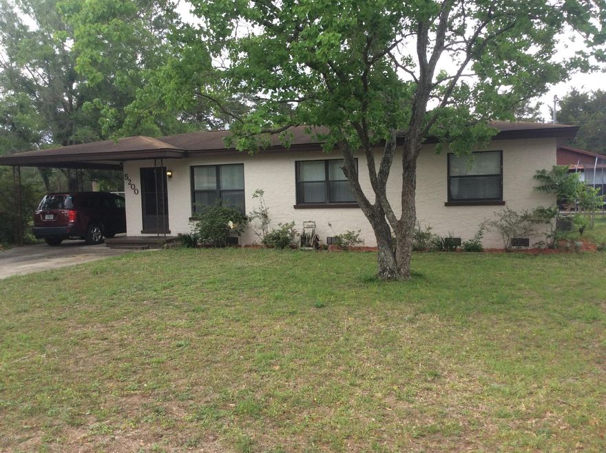 Fantastic investment or first time buyer opportunity.  Huge yard with a beautiful screened in back porch.  Talk about a bonus,  3 car garage/workshop in the back yard with Electricity, a half bath and a fish cleaning station.  Garage needs a little work but is usable as is.  Cinder Block with Stucco finish.  Huge eat in kitchen and laundry room.  This home has a huge bang for the buck.  Home has a tenant and will require a 30 day notice from date of effective contract.  This home won't last long at this price so check it out today.