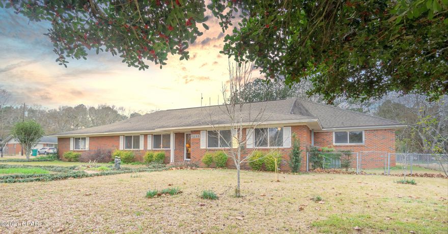 SO MUCH SPACE to grow and play!! This beautiful 4-bedroom, 3 bath home has been well maintained and boast oversized eat-in kitchen with island, custom tiled back splash and granite countertops, formal living room, family room, two additional bonus rooms that could serve as an office or game room and an attached mother-in-law suite equipped with eat-in kitchen, walk-in closet, and full bath. The massive master suite features his/hers closets, custom crown molding, an additional walk-in closet and full bath. Outside you will find an attached carport, fenced backyard, screened in porch and a 20x40 workshop/pole barn with lean-too all situated on an oversized city lot.