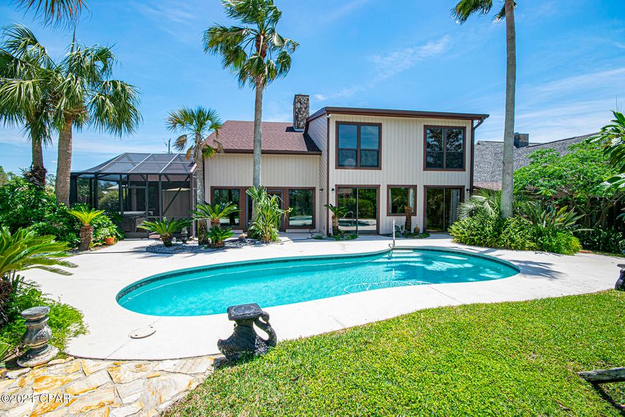 'CURRENTLY UNDER CONTRACT, SELLER ACCEPTING BACKUP OFFERS Here is an opportunity to own a great home with pool,  90' on the canal, with a boatlift!! In today's market this is a rare gem.  Minutes to the Gulf from the back yard canal, this 4 bedroom 3 ½ bath, 3360 square feet home offers old world charm and a private oasis only minutes from downtown, beaches and shopping.  Located in Kings Ranch, this contemporary floor plan features true hardwood floors throughout, soaring ceilings in the combo formal living room/dining room, and a comfortable Spanish tiled family room right off the kitchen.  The kitchen was designed for a professional chef's tastes, with commercial grade GE Monogram range with 6 burners and grill, double ovens,  Kitchen Aid refrigerator, Bosch dish washer and a custom stainless prep area. Custom cabinets, drawers, pantry 
 areas offer a multitude of storage.  Corian counters with overhead pendant lighting surround the chef's area for a dine in experience at the high-top breakfast bar.  This home also features a "Bodega" climate-controlled wine room able to hold 1200 bottles on its redwood lined racks, and a wet bar with ice maker, off the family room.  The Master bedroom overlooks a private screen enclosed patio featuring a sauna and hot tub, all steps from the swim-jetted lap pool. The master bath features a 35 sq ft super shower, pedestal bowl sinks, and ceramic tile.  "Upstairs-downstairs" this home has two staircases with the main staircase opening to a light and airy loft with built-ins for an office.  Two bedrooms share a bathroom, and the 4th bedroom could be a second-floor master with private bath done in travertine tile.  The back staircase leads you back full circle to the family room.  There are closets and storage spaces, art nooks and European decorator touches everywhere to discover throughout the home.  Stepping into the back yard is truly a sanctuary with the pool and deck overlooking Grapefruit, Orange, Fig, Cumquat and Loquat trees planted in the huge lot that slopes to the canal and the covered boatlift that can accommodate up to a 25' boat. With too many features to list, please make your appointment today to see this great home.  Ask your Realtor for a features list!  'CURRENTLY UNDER CONTRACT, SELLER ACCEPTING BACKUP OFFERS