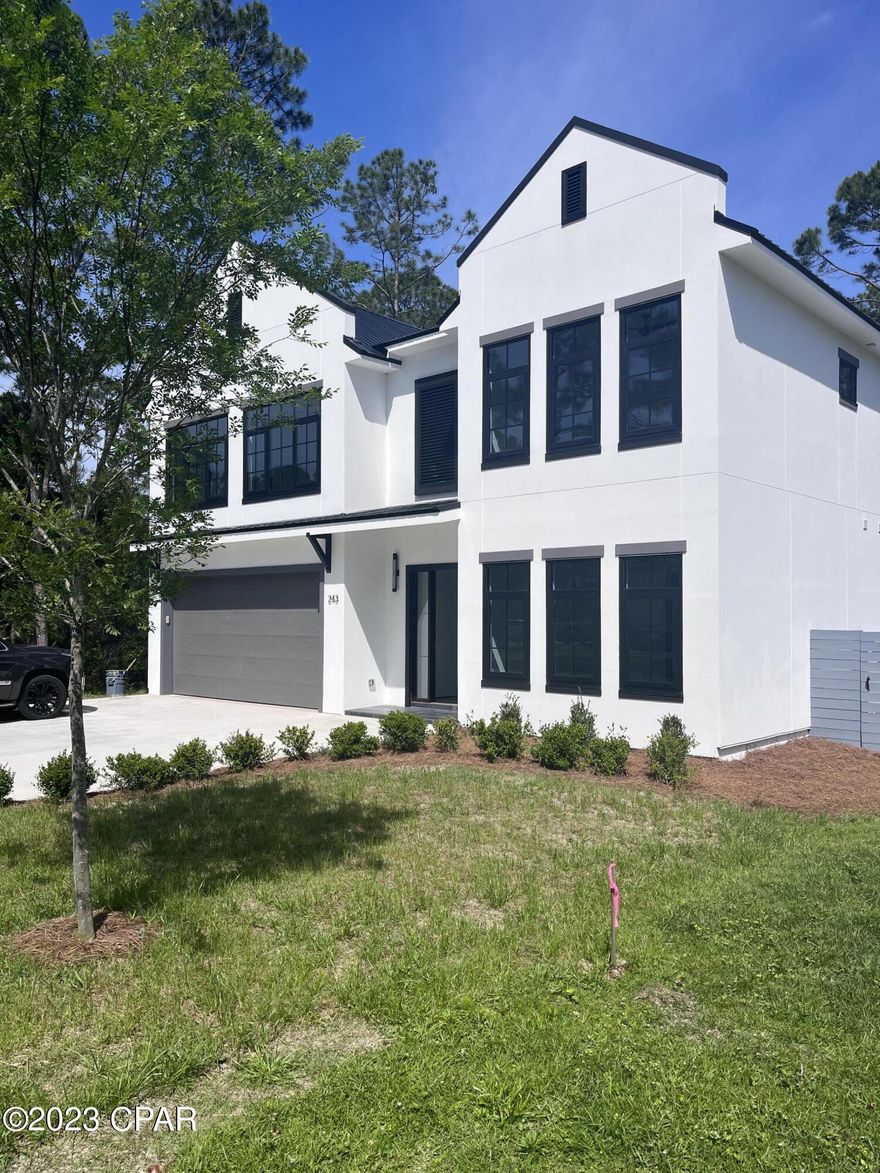 In the heart of Mack Bayou between Sandestin and Hwy 30A, you'll find a rare opportunity to live in modern luxury surrounded by wooded tranquility. This new construction home rarity is less than 2 miles from the shops, dining and entertainment of Sandestin, around the corner from Sacred Heart Medical and just minutes from the white sandy beaches of Hwy 30A. This home boasts 10' ceilings on the lower and upper levels, master suites on both floors with a total of 4 large bedrooms and 3.5 bathrooms with loft area open to below. The spacious great room is perfect for entertaining and access to the private back yard through the covered patio. Mack Bayou Estates is an established neighborhood in Santa Rosa Beach with no operating HOA. This retreat will have bragging rights as it is adorned is smooth white conventional stucco and sleek, black modern windows and doors. A two-car garage with ample space was thoughtfully designed for the full-time resident or second home resident in mind. The back yard is oversized and is the perfect place to create your own oasis with a lanai or patio for the best entertaining on the block. This residence features city water and sewer as well as irrigation. High-end appliance package and beautiful tile and cabinetry, this new construction home is a gem.