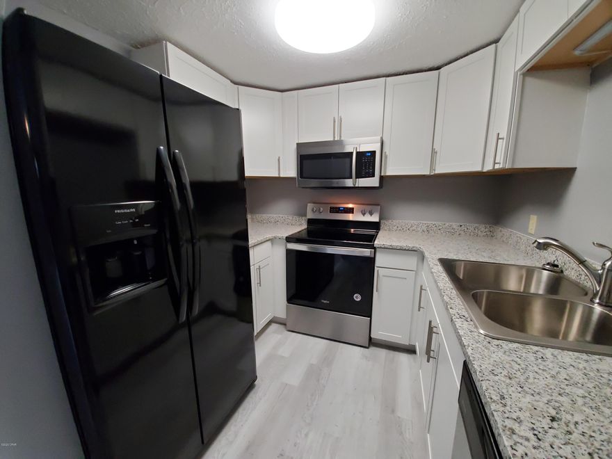 For rent! Newly remodeled 3 BR, 2 BA town home in the heart of Lynn Haven! Enter into the living room with vinyl plank flooring throughout the living space, and into the kitchen and dining room. Kitchen features new stainless appliances, granite and custom cabinetry; Across the kitchen is the dining room and sliding door to the private patio & fenced back yard. Inside laundry w/ washer/dryer included. The home has a split floor plan with master BR on back side offering sliding door access to patio, en suite bathroom w/ tub/shower combo. On the front side of the home are the two additional BR's and BA. New carpet, fresh paint, all new interior finishes and move in ready! **NO pets allowed.