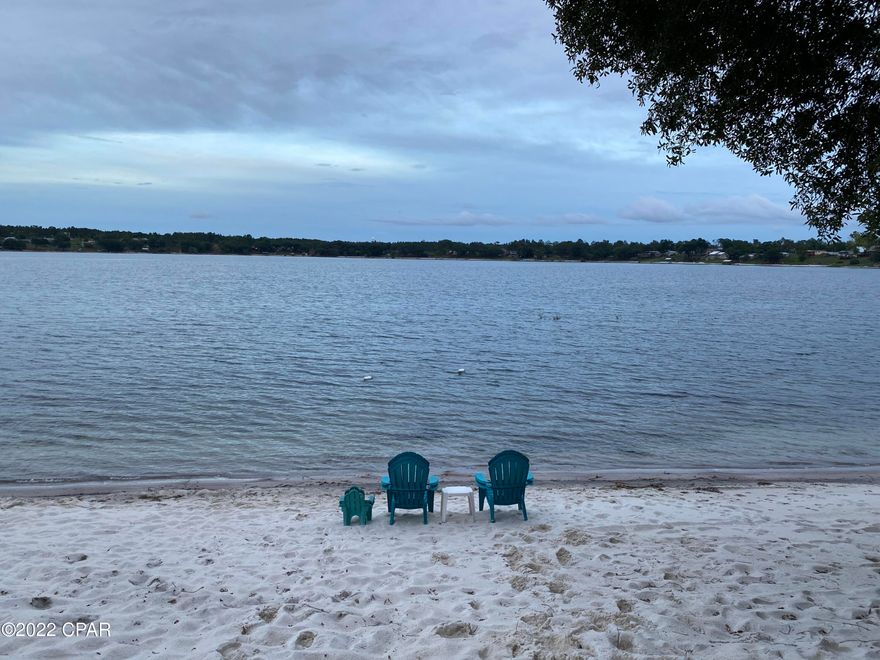 CURRENTLY UNDER CONTRACT, SELLER ACCEPTING BACK UP OFFERS. This Crystal Lake dream home sits high on a huge lot with a sugar white beach. This amazing home has been recently remodeled to include floors, paint, stainless appliances, custom fireplace, high speed internet, underground utilities and so much more. The screened in porch provides another serene space that overlooks the shady yard and beautiful lake. A covered porch below has plenty of room for lounging after a swim and an outdoor shower as well. The custom fencing is top of the line. Enjoy sunset cruises by boat or kayaks. This is a must see, you won't want to leave! Call today to schedule a showing of your future waterfront home!