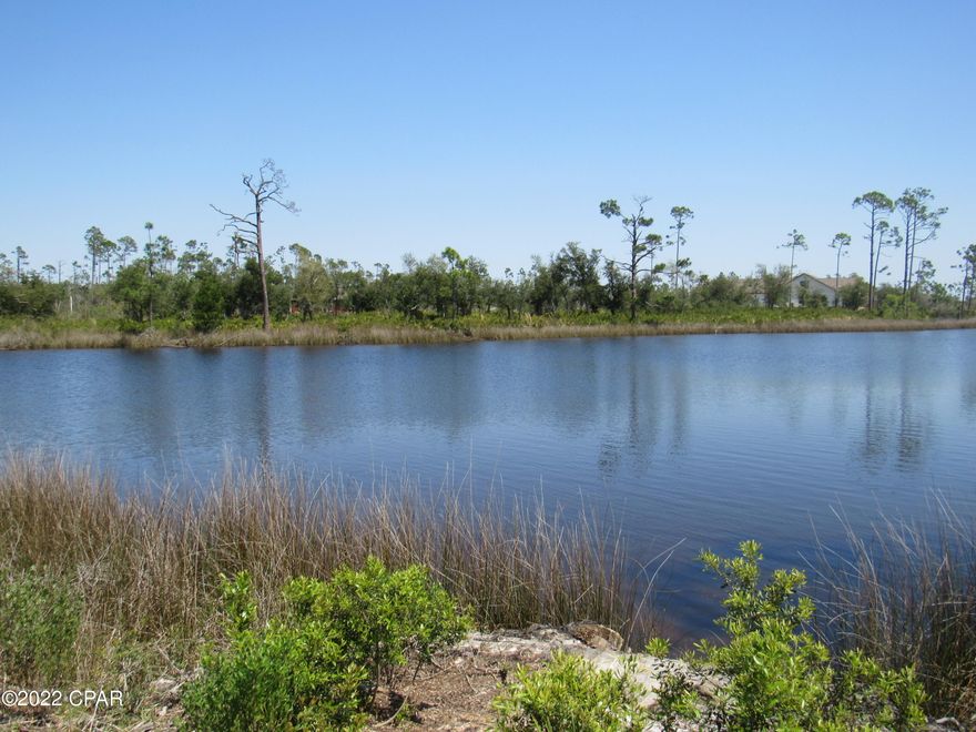 CURRENTLY UNDER CONTRACT, SELLER ACCEPTING BACKUP OFFERS! Laird Point is a beautiful gated waterfront community on East Bay.. This is an extra large lakefront lot so plenty of privacy and waterway pleasures for those who delight in nature's coastal beauty. Laird Point subdivision features a double tennis court  and beautiful bay views!   East bay is known for it's fishing and this lot has a beautiful view.  Lot has not been cleared, but public sewer, public water, and underground electric is available.  Please verify all information for accuracy.   Hurry this one will not last long!