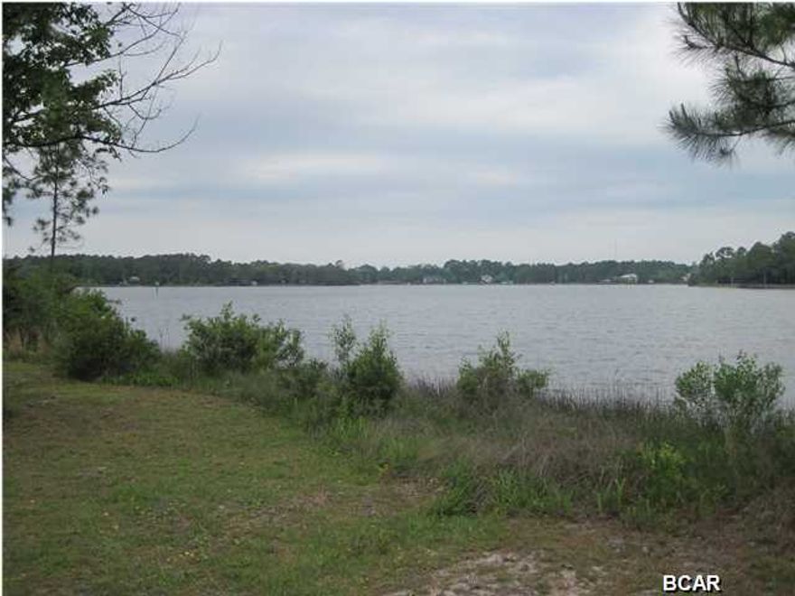 DRASTIC PRICE REDUCTION ON THIS BAY FRONT PROPERTY WITH DEEP WATER! COMMERCIAL POTENTIAL FOR BOAT STORAGE/MARINA! Owner motivated to sell this beautiful old homeplace with nice trees and grassy lawns. This 2.5 acre property has 165 feet of waterfront, and measures 660 feet from the waters edge to Buchanan St. The property is right on the DEEP WATER CHANNEL, just inside of Fanning Bayou and has DEEP WATER ACCESS TO NORTH BAY AND THE GULF OF MEXICO. No value given to the existing house. It has some damage from a lightning fire, but can be salvaged. Two other homesites have water and septic connections available. Measurements approximate, verify if important.