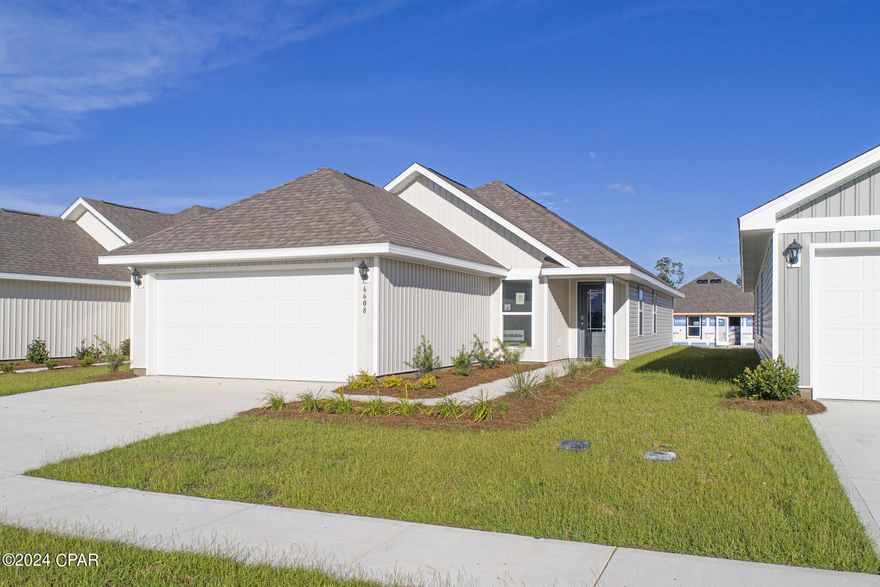 New home under construction in Liberty located in Panama City. This Celeste floor plan is located at 6608 Kettles Street. As you enter this home you will notice the bright entry way afforded by the prairie door.  This 3-bedroom 2-bathroom, 1403 square foot home is an open concept floorplan.  The primary bedroom and bathroom are located off the entry at the front of the home.  The primary bathroom has double sink vanity, large shower, and a huge closet.  Proceed down the entry hallway passing the laundry area as you enter into the kitchen, dining, and family area.  The kitchen offers a breakfast bar with space for seating.  On the opposite side of the home from the primary bedroom upfront, there are two spacious secondary bedrooms separated by a shared bathroom.  This home includes standard appliance package that includes a smooth top range, dishwasher and microwave as well as design features; EVP flooring, granite countertops and bright white cabinetry.  Liberty neighborhood is conveniently located in beautiful Panama City off Star Avenue near 231. Located just 25 minutes from Tyndall Airforce Base, 20 minutes to hospitals, and less than 15 minutes to shopping, restaurants, and grocery stores you will be amazed at the convenience once you enter the winding entrance to this beautiful sanctuary. Liberty, D.R. Horton's premier new lifestyle community, offers a 7,500 square foot community center with full gym, wellness rooms and much more. Additionally, behind the community center is a water wonderland with resort style pool, splash pads, and an outdoor grilling kitchen with seating.