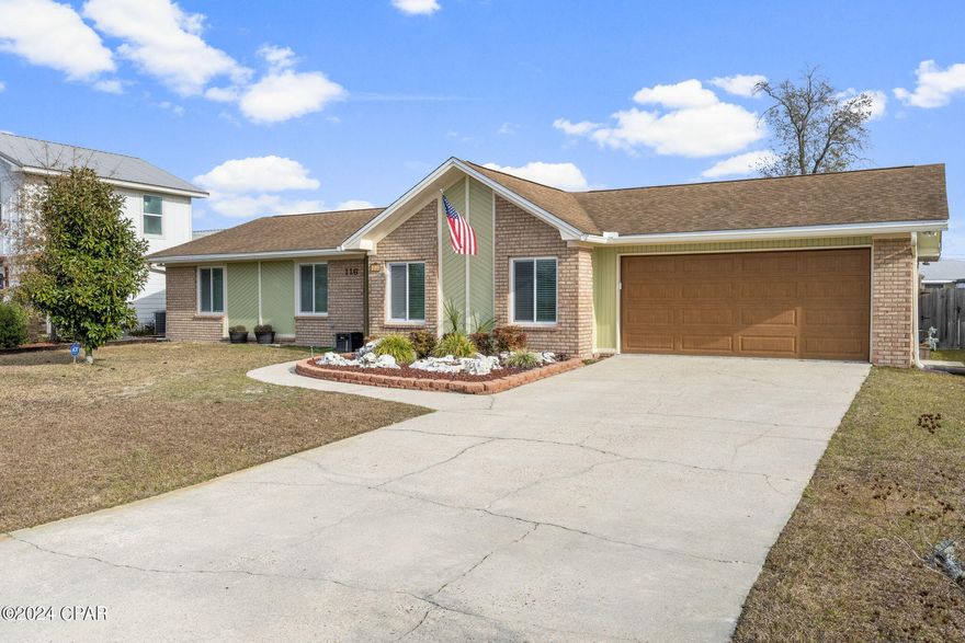 CURRENTLY UNDER CONTRACT, SELLER WILL CONSIDER BACKUP OFFERS.  This home offers a unique and stylish layout and an outside space that allows room to breathe. Inside, you'll find a beamed vaulted ceiling that's basically the house's way of saying, ''Look up, I'm fancy!'' The living and dining spaces are open and inviting and bonus features throughout include upgraded fixtures, wainscotting, and easy-to-maintain LVP and tile floors so you can enjoy the beauty of your home without the hassle of constant upkeep. A pocket glass door opens to the den with a fireplace and this room offers endless possibilities - whether you envision it as a space for a pool table, a bar for entertaining, or a kids' playroom.  The kitchen, while close to the living area, is separate and offers the chef their own culinary space. The quality finishes add a touch of sophistication you'll appreciate - custom Kitchen Maid cabinetry with added pull-out drawers and organization features, slow close drawers, stainless appliances and that highly desired gas stove every chef wants. And say goodbye to traditional faucets because we have a touchless faucet that's more high-tech than your grandma's TV remote.  The kitchen has an eat-in breakfast bar style island, but don't like it? It's moveable so you can make the space your own! All bedrooms are of good size and the primary bedroom will easily fit that king-size bed. The organizer in you will appreciate the added closet shelving. The remodeled primary bath is a true delight, and the tile shower is quite spacious. Outdoors, you've got a large lot with a privacy fence, perfect for hiding from your nosy neighbors. There's a spacious open deck for all your outdoor shenanigans, and a shed for storing all the things you bought online at 2 AM. And don't forget the hot tub - perfect for relaxing under the stars. This home is nestled in the popular Derby Woods community, known for its busy Halloween nights and neighborhood yard sales. Lynn Haven is renowned for its top-rated schools and this home is also conveniently located near North Bay Haven charter school. Tyndall AFB and NSA PC are only 25-30 minutes away. Come check it out and let's toast to your new ''Home Sweet Home!'' Measurements approximate, buyer to verify if important.