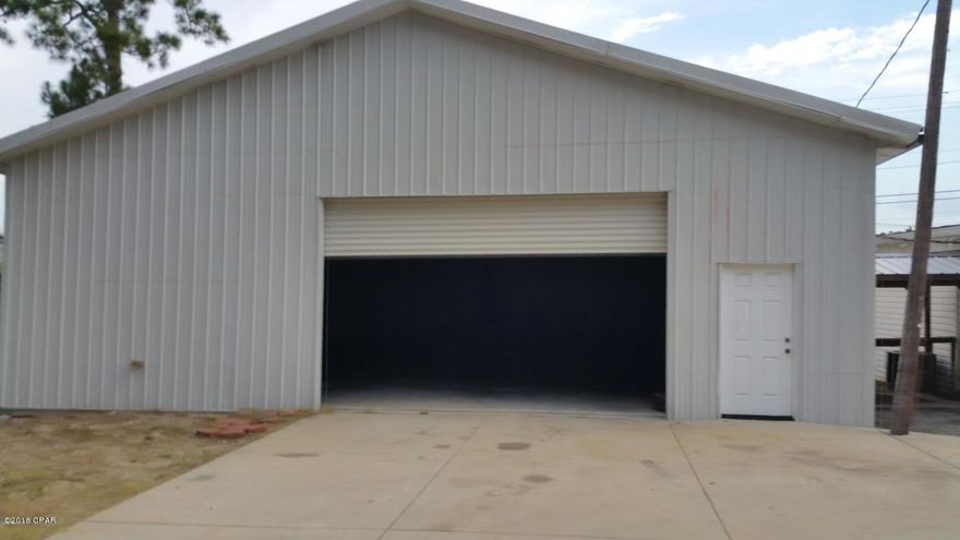 LOCATED ACROSS FROM THE NAVY BASE. 

 Two Parcel ID's: 30158-020-000 and 30158-030-000.  THREE BUILDINGS - 2,880 sqft WAREHOUSE, a 2,400 sqft Showroom, and a 1,020 office building.   The WAREHOUSE IS HEATED & COOLED with closed-cell insulation (stays nice and cool).  It includes two car lifts and an air compressor.   It has a roll-up door.   The SHOWROOM has a main floor area and 3 office plus other storage areas.  The small office space sustained some hurricane damage.   Roof has been repaired, ceiling has not been replaced.  Tons of possibilities.