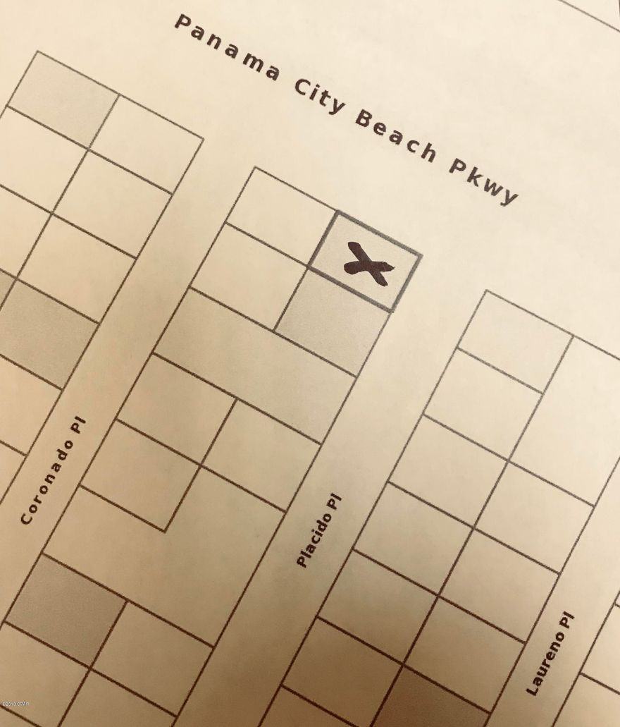 Beautiful building lot in Laguna Beach. A short walk or ride in your golf cart to the white sandy beaches; There is sewer on this property giving you more bedrooms and baths than on regular septic lots.