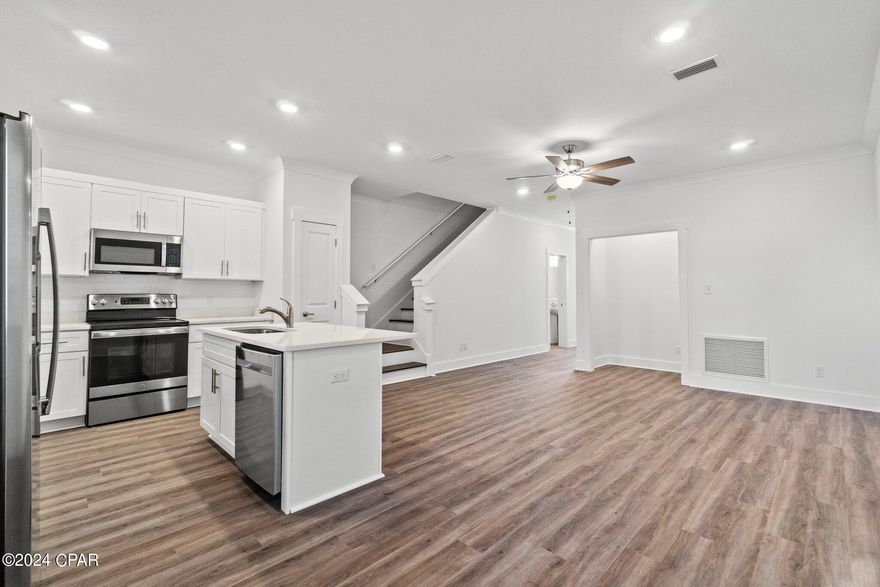 The Verandas at Freeport provide a luxury living style,  convenient to local beaches. This is a well cared for 3 bedroom/2.5 bath home. The townhome, built in 2022, has stainless steel appliances, LVP floors throughout, soft close cabinets, quartz counter tops, and wood blinds . HOA includes pool access, lawn care, and trash. This is the perfect home for a small family, or for someone looking to expand their rental portfolio. All measurements are approx, and should be verified.