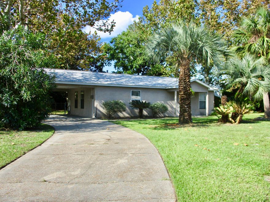 CURRENTLY UNDER CONTRACT, SELLER ACCEPTING BACKUP OFFERS. Look at this price for a move in ready home in Panama City Beach! 2 bedrooms, 2 baths, attached carport and a sun room that is a great bonus space.  New roof, tile floors and a spacious corner lot with a fenced in backyard.  Conveniently located near Coastal Stations on Thomas Drive, great schools, the world's most beautiful beaches, and all Panama City Beach has to offer!  Homes in this price range do not last - call today for your showing!