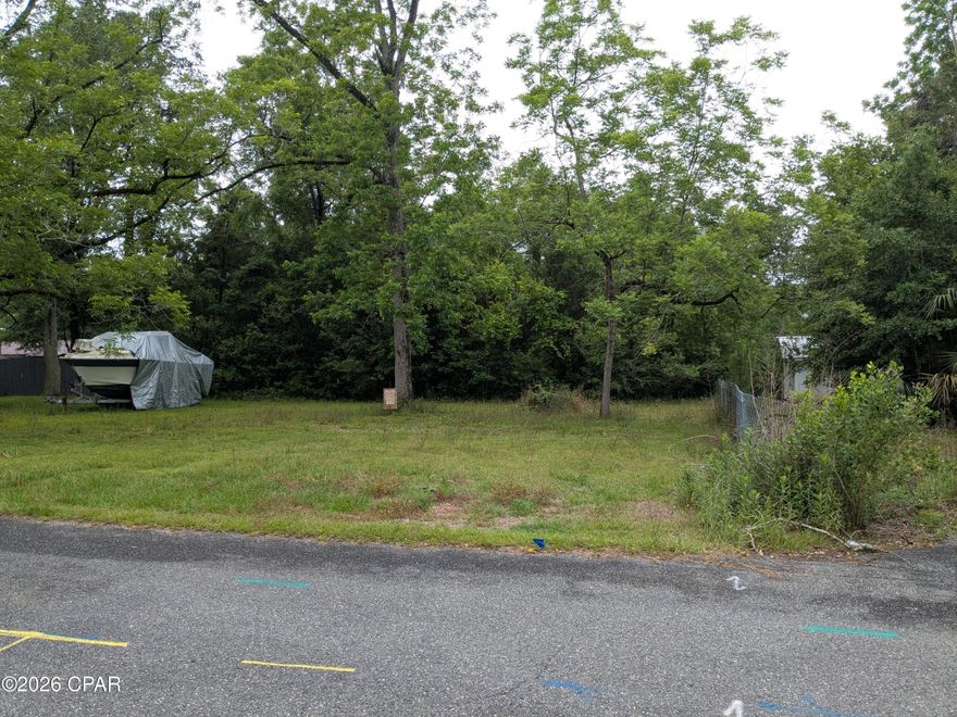 Lot located in quiet neighborhood on cul de sac. Front half of lot is cleared and ready to build on. The back half of lot is wooded and fronts Cedar St. The Bowers St side has water and sewer already run to lot. The lot is level with very nice shaded trees on it.