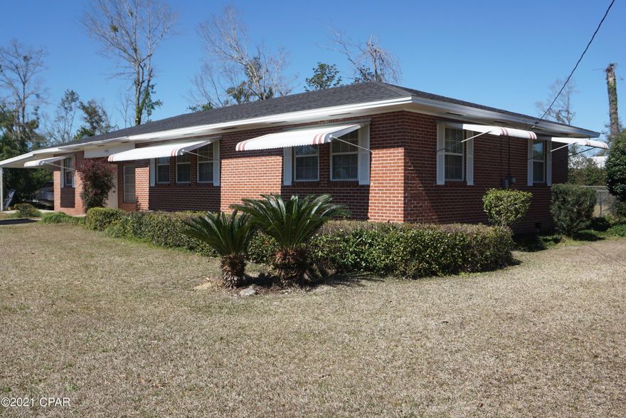 PROPERTY UNDER CONTRACT; SELLER ACCEPTING BACKUP OFFERS. 3 bedroom, 1 a half bathroom home in downtown Marianna, in close proximity to Jackson Hospital, Chipola College, schools and shopping. This home features original hardwood floors in the living area, exposed brick in the dining room, large covered patio, and fenced in back yard. The kitchen appliances are only 3 years old. The home also has an attached two-car carport. This home is in a quiet neighborhood, and would be a perfect starter home or home for someone looking to downsize. There is an outside shed with water and electric.