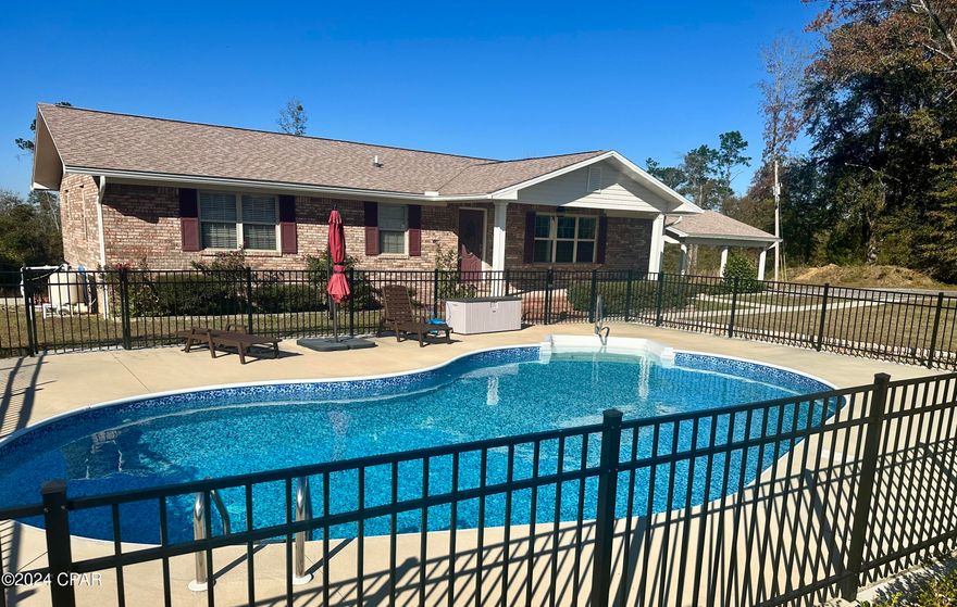 Welcome to your dream country brick home! At the end of a dead-end street, this completely remodeled 3-bedroom, 2- bathroom gem offers the perfect amount of country and convenience! Located directly in the middle of Grand Ridge and Sneads school, this home is perfect for families looking to be close to town but has that country feel. The homes comes with a saltwater pool that is fully fenced in, a 2 car carport, a 24'x48' pole barn and a nice storage shed with a roll up door! 

Step inside and you have a beautiful open floor plan with 3 large bedrooms and 2 very big bathrooms! That master bath has a gorgeous walk-in shower! The kitchen has solid wood cabinets and stainless-steel appliances.

Downstairs is a full basement that has lights and electrical outlets. There is access from inside the home and double and single door access from outside. 

The home has a nice double deck out the back of the home with a swing and tons of wood bench seating.

Don't miss your chance to own this beautifully remodeled home in this prime location between Grand Ridge and Sneads! Schedule a tour today!