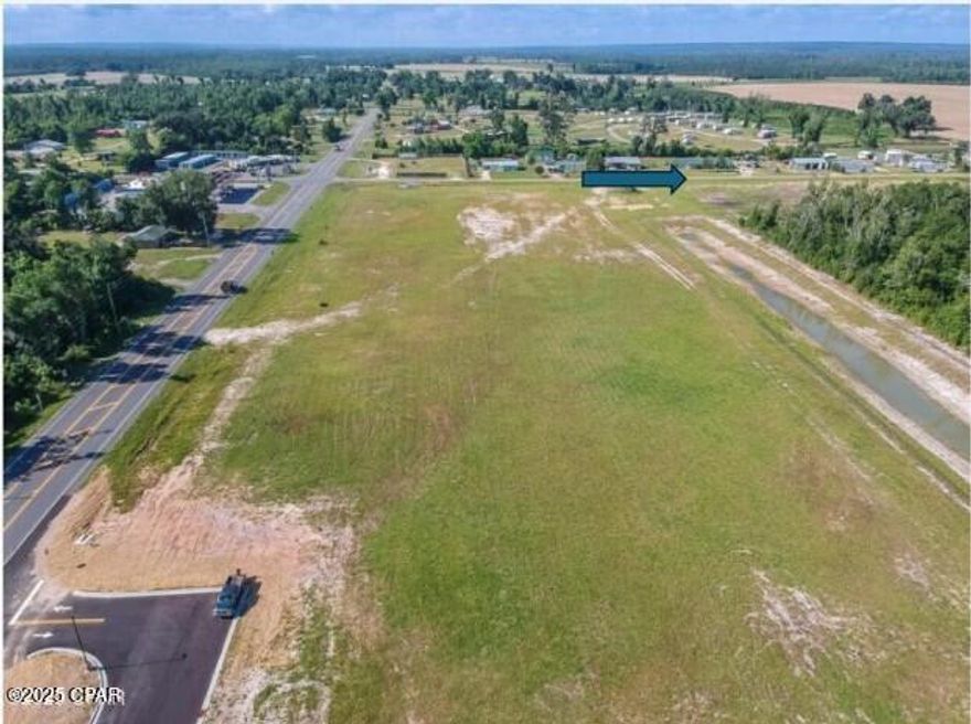 Approved 40-unit Townhome community, with development order in place, situated on 3.41acres of Prime Commercial Property.  This is an amazing project for a builder to take over and the sellers are willing to release all plans, permit information, and all studies done on the property, including the topographic survey.  The property has an agreed easement  allowing the townhome community to connect with the stormwater in place to the immediate right.  With water and sewer lines running on both HWY 71 and Hope School Road, and natural gas available, infrastructure costs should be low.  The current plans allow for 8 buildings with 5 units per building.  Each unit is 1424 SQ.FT. and can be designed as a 2- or 3-bedroom plan and all have a single car garage.  There is a need for a community like this in Marianna, and this is an ideal location.  There is a newly constructed 4-story Hampton Inn to the north, that opened in May 2023, and multiple restaurants within half a mile or less. This parcel is just minutes from I-10, which sees over 20,000 vehicles daily and is located in the heart of Marianna, surrounded by major projects. Yours could be next! There is an HOA, and documents are attached to the listing, but fees are not in place at this time. An agreement is in place for shared drainage and easement maintenance based on pro-rata ownership with the hotel, lot to the right, and townhome community owner. If this sounds like the property you have been waiting for, make an appointment to view today before this prime commercial property is no longer available. All information is deemed reliable but must be verified by the buyer via personal or formal inspections.