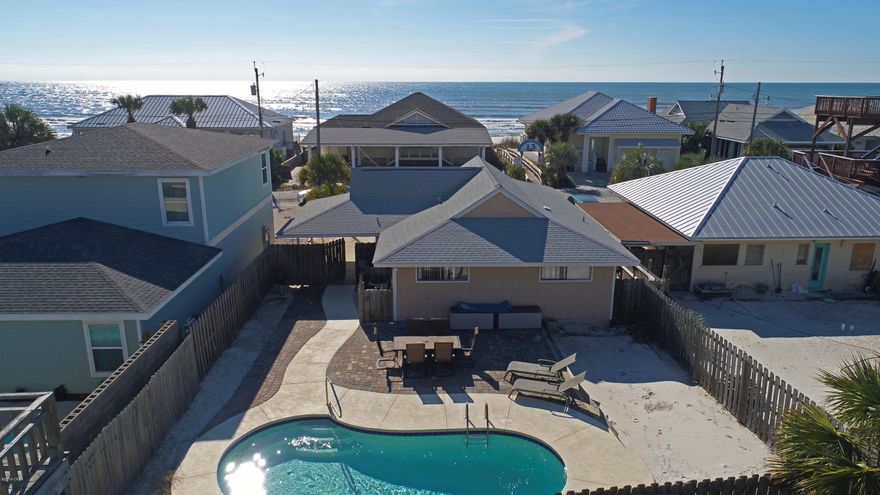A little slice of paradise on a quiet neighborhood street- just 20 steps to the beach walkover and the shimmering white sand and emerald gulf waters. Charming beach house across the street from the beach with sparkling in-ground pool. Gorgeous kitchen with stainless steel appliances and granite counter tops. Extra room in front can be used as a bedroom, den or office. Great for your family retreat and this home can produce a  nice rental income when you're not there. Finish off your beach day with a relaxing dip in the pool or prepare a gourmet meal in the beautiful kitchen- all while creating family memories to last a lifetime!