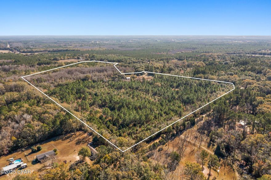 Discover the perfect blend of privacy, potential, and convenience with this 55± acre tract offering endless possibilities. The property features a pond and a pole barn, adding both charm and functionality for agricultural use, storage, or recreational enjoyment. With ample space to bring your vision to life, this expansive acreage is ideal for a private estate, recreational retreat, agricultural pursuits, or future investment. Tucked away in a peaceful rural setting, the property is located just 7 miles from Vernon and approximately 45 miles from the pristine, sugar-white sands of Panama City Beach—providing the perfect balance of quiet country living with easy access to town amenities and the Gulf Coast.