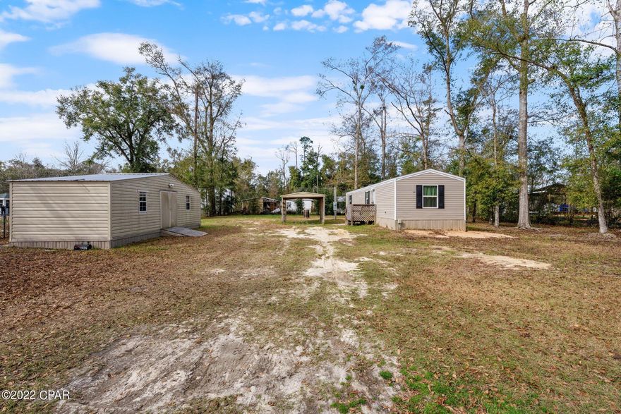 Fantastic property with a 2019 single wide with a pole barn and a heated and cooled storage building. Two spacious bedrooms, open kitchen and living area with breakfast bar. A wonderful layout. Large workshop/ building about 434 sqft, insulated and heated and cooled is the perfect storage building or workshop.  Plenty of parking and room for RV parking on this lot. Move in ready home with so much potential!