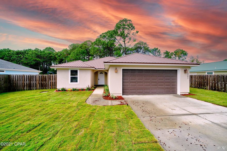 BETTER THAN NEW!!! This Stunning home with a HUGE lot, new sod, 2 Papaya, 1 Avocado, and 1 lime tree in a VERY spacious back yard.... is waiting for YOU!!! Open concept, GORGEOUS 3/2, has custom blinds, granite, stainless steal appliances, secutity cameras, fenced in yard, very LARGE tiled shower in the master......everything one could hope for and more!! The location is perfect, be at the beach in minutes, Navy Base very close,  or over the bridge to PC easily. Great schools, shopping, literally an AMAZING opportunity awaits you! Buyer to confirm measurments. Call your favorite Realtor to see this one TODAY!! You will be glad you did!