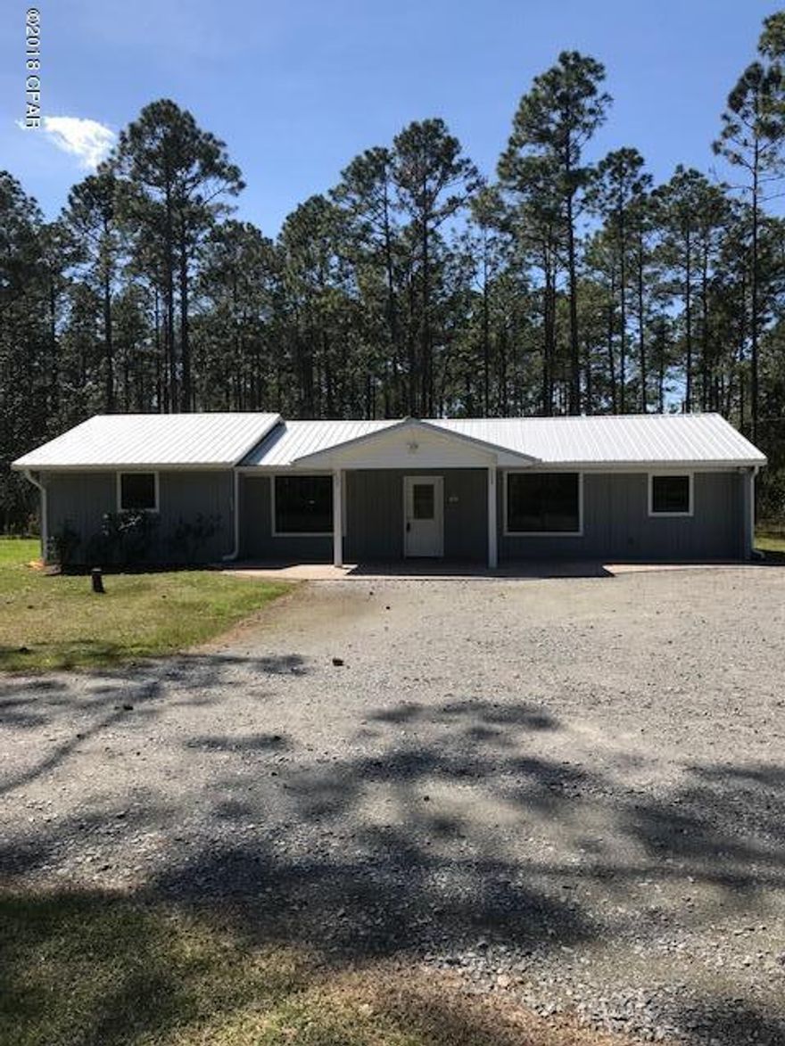Completely renovated 3 bedroom 1 bath home centered on 10 acres. Effective Age of house is 2015. The home has been updated with ceramic tile flooring, modern fixtures, double pane windows, doors, and moldings. Kitchen has Granite counter tops, decorative back splash, cherry wood cabinets, top of the line Frigidaire Gallery stainless steel appliances which include a ceramic top stove with double ovens, built in microwave, side by side refrigerator with ice and water dispenser, and dishwasher. Flooring in kitchen and dining area is 18 inch ceramic tile.  The living room and master bedroom have wood grain ceramic tile. The other 2 bedrooms and bath have 12 inch ceramic tile flooring.  The bathroom has Granite counter tops with a double sink and top of the line fixtures. The tub/shower is enclosed in decorative ceramic tile.  The exteror of the house has been recently sealed and painted.  It has a modern medal roof with a gutter system.  The front porch provides that perfect spot to observe the deer grazing at the back of the property.  The flooring of the porch consist of decorative pavers.  The entry to the 10 acres is through a rod iron gate with decorative fencing across the front of the property.  The property has numerous, recently planted leyland cypress and other trees.  Two ponds are present on the property.  The front pond provides water for the sprinkler system on the property. The property also contains a 37' x 40' workshop/garage.  The building has several rooms.  It has a storage room with a 7' x 9' garage door.  This area is perfect for lawn equipment, etc.  The main section of the building has 14' wide roll up door 8' in height.  The area covers the full length of the building.  Perfect for boat storage or multiple cars.  The other section of the building has a 6' double door and it also covers the full length of the building.  There are also 2 other rooms in the building for many uses.  If you are looking for a real nice small home with a tremendous out building surrounded by 10 acres, take a look at this one.  It just may be what you are looking for.  Laird Bayou and Laird Point Developments are in close proximity of the property.